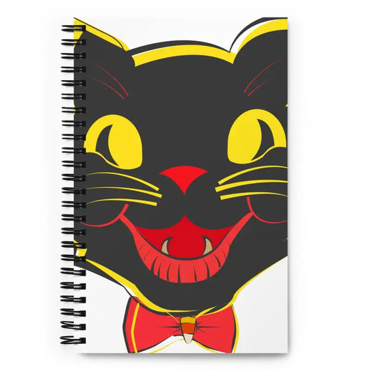 Black cat cartoon with yellow eyes and red bow tie on Mischievous Cat Spiral Notebook cover