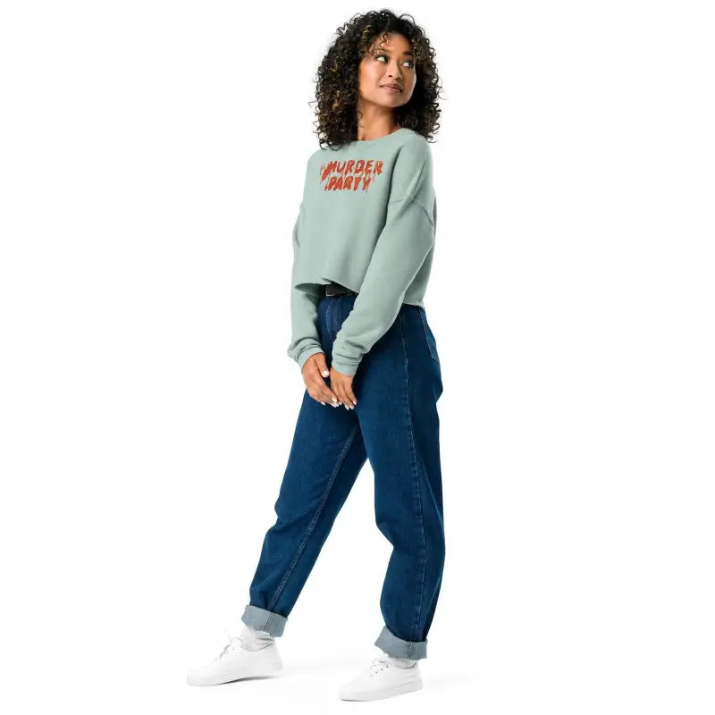 Person in mint green sweatshirt and jeans showcasing Murder Party Fleece Crop style