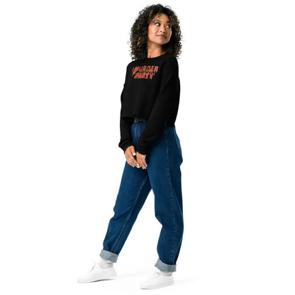 Person in black sweatshirt and blue jeans modeling Murder Party Fleece Crop