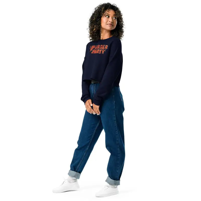 Person in navy sweater and blue jeans showcasing the Murder Party Fleece Crop