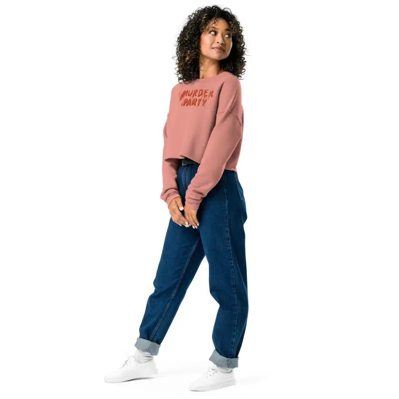 Person in pink sweatshirt and blue jeans showcasing Murder Party Fleece Crop style