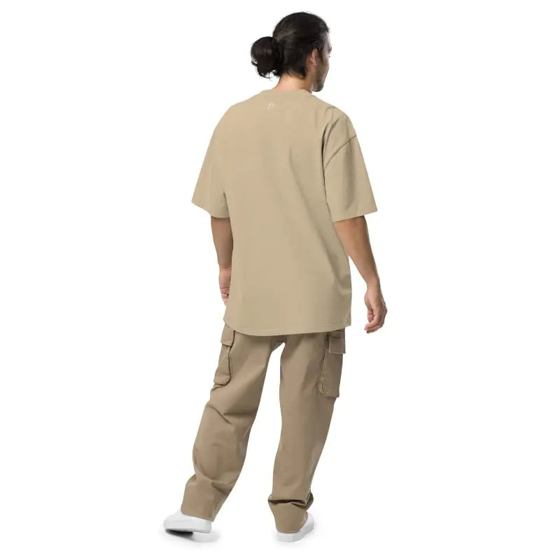 Person in beige medical scrubs and cargo pants featuring Murder Party Mayhem T-Shirt