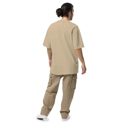 Person in beige medical scrubs and cargo pants featuring Murder Party Mayhem T-Shirt