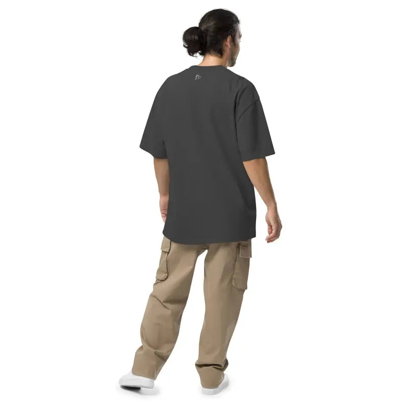 Person in dark oversized Murder Party Mayhem T-shirt and khaki cargo pants