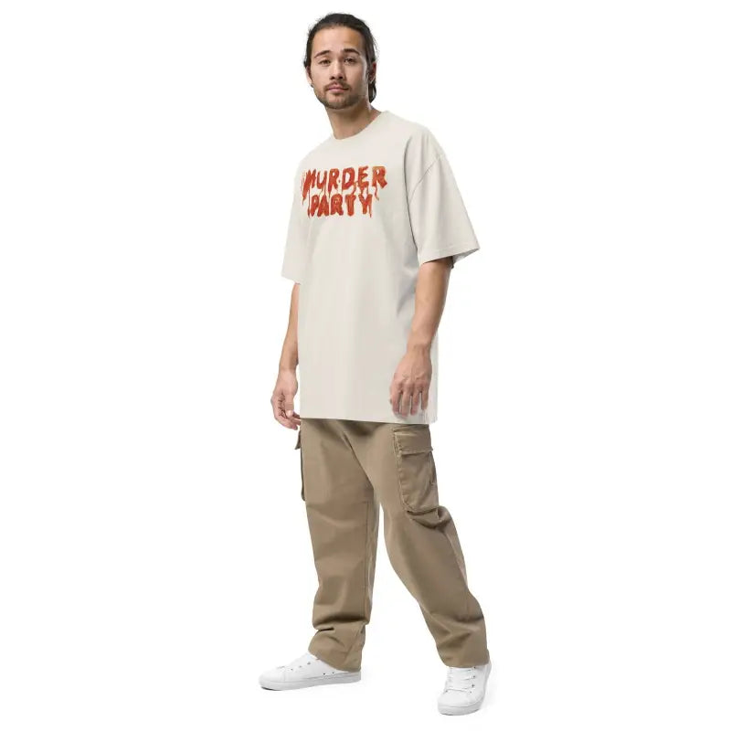 Person in cream t-shirt with red text and khaki pants from Murder Party Mayhem collection