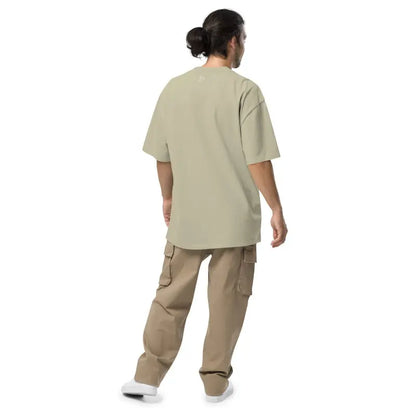 Person in a beige t-shirt and khaki cargo pants showcasing Murder Party Mayhem style