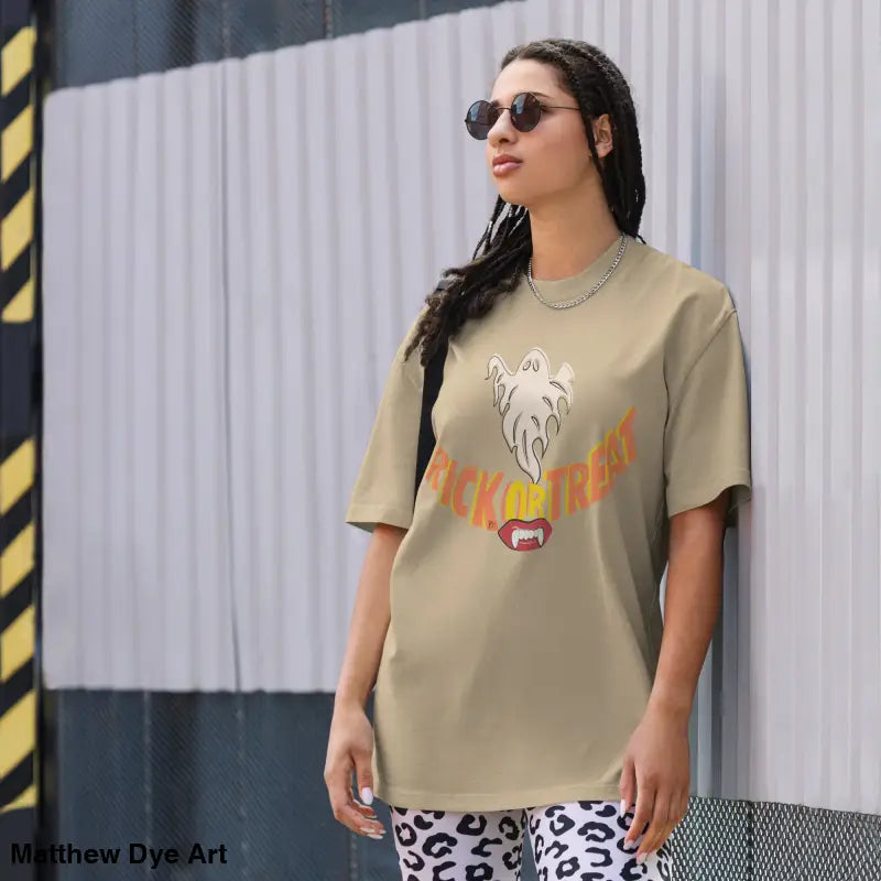 Beige oversized faded t-shirt featuring vampire fangs design for Halloween treat smiles