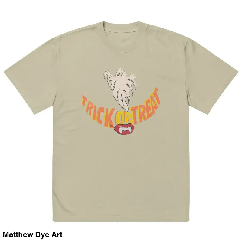 Beige oversized faded t-shirt featuring vampire fangs and Halloween graphic for treat smiles
