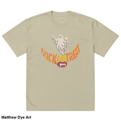 Beige oversized faded t-shirt featuring vampire fangs and Halloween graphic for treat smiles