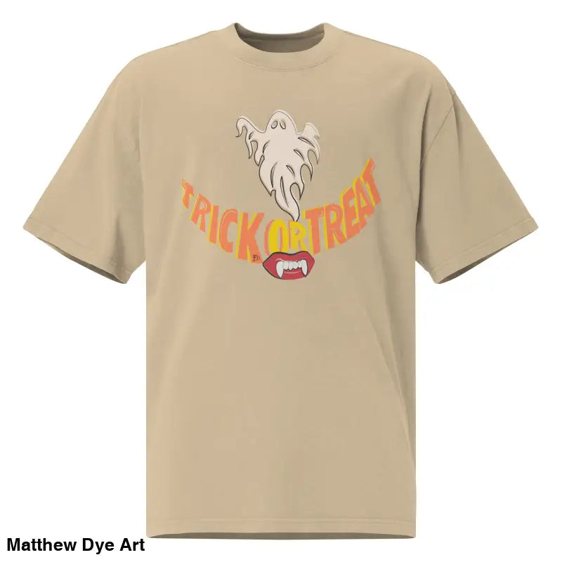 Beige oversized faded t-shirt featuring a Halloween graphic of vampire fangs