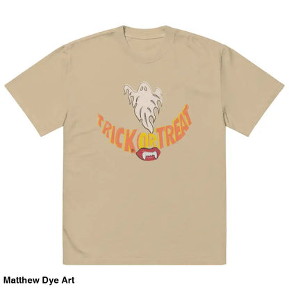 Beige oversized faded t-shirt featuring a Halloween graphic with vampire fangs