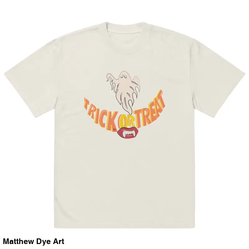 Beige oversized faded t-shirt featuring Halloween graphic of vampire fangs and treat smiles