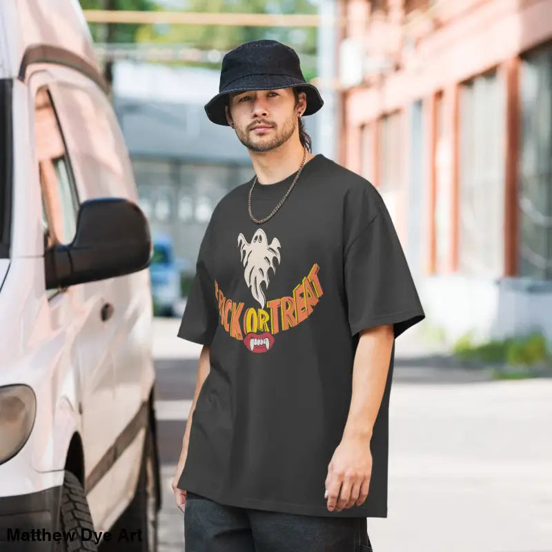 Black oversized faded t-shirt featuring vampire fangs design for Halloween treat smiles