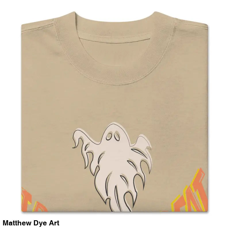 Folded tan t-shirt featuring ghost graphic from Phantoms & Fangs oversized vintage Halloween tee