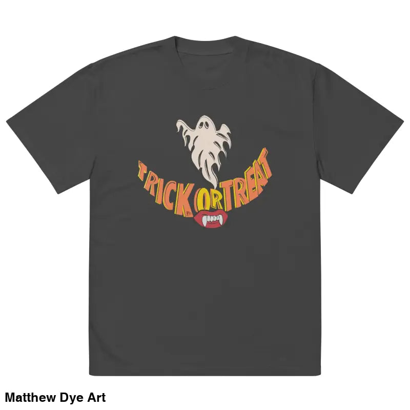 Gray oversized faded t-shirt featuring Halloween graphic with vampire fangs and treat smiles