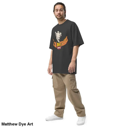 Man in oversized faded t-shirt featuring vampire fangs and cargo pants for Halloween