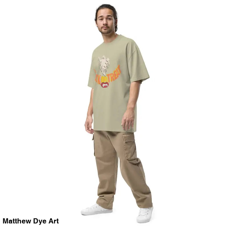 Man in oversized faded t-shirt and cargo pants showcasing the Phantoms & Fangs design