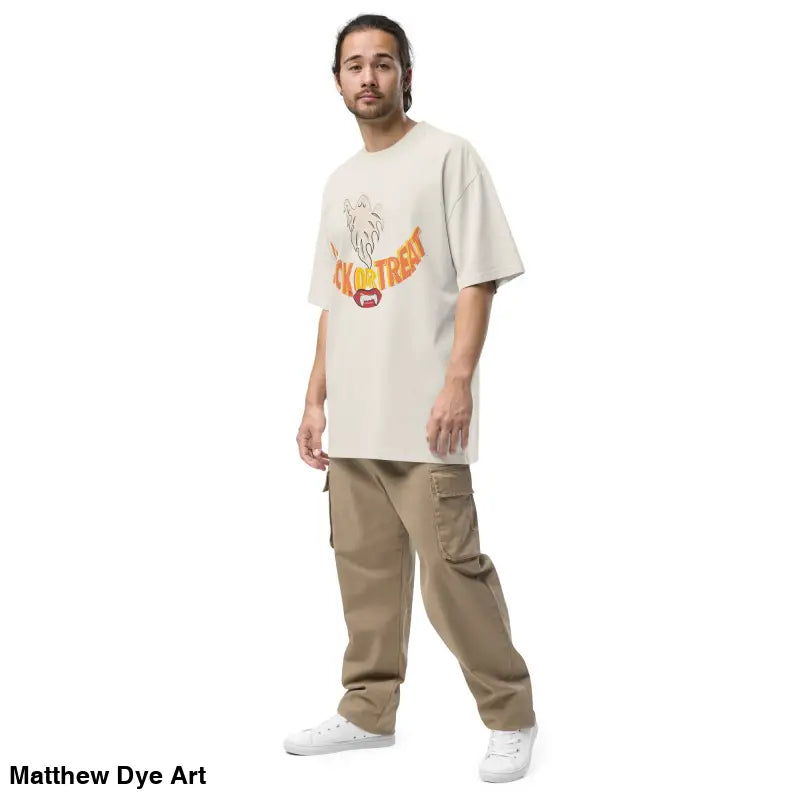 Man in beige oversized faded t-shirt and cargo pants from Phantoms & Fangs collection