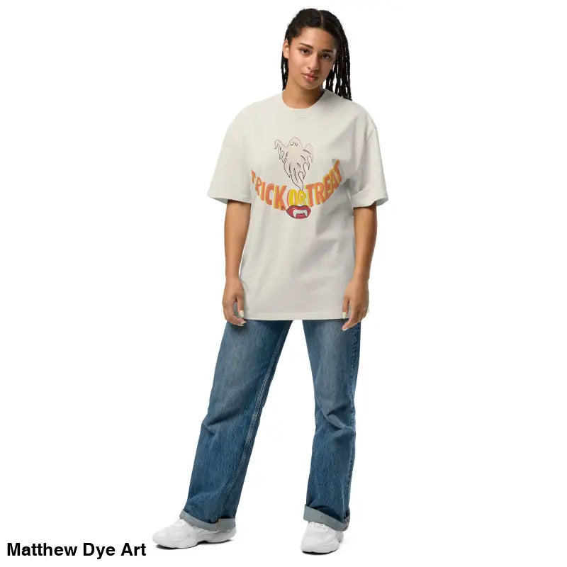 Woman in oversized faded t-shirt with vampire fangs design, showcasing Halloween style