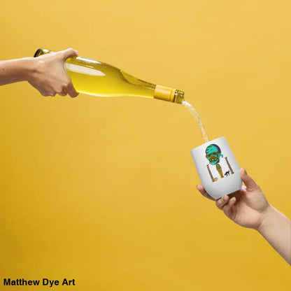 Wine being poured into Pharaoh’s Curse Wine Tumbler showcasing Matthew Dye art