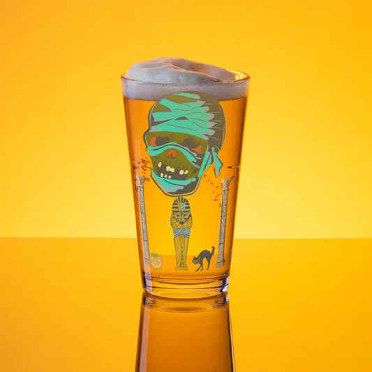 Mummy-themed beer glass with foam for your favorite refreshing drinks and Halloween fun