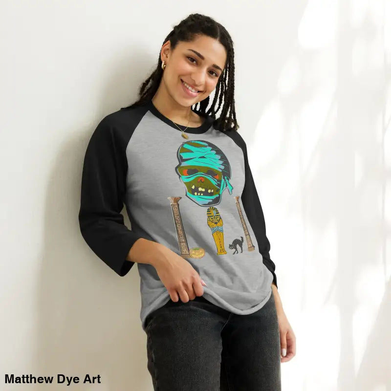 Gray raglan shirt featuring Matthew Dye art with mystical mummy charm for Halloween lovers