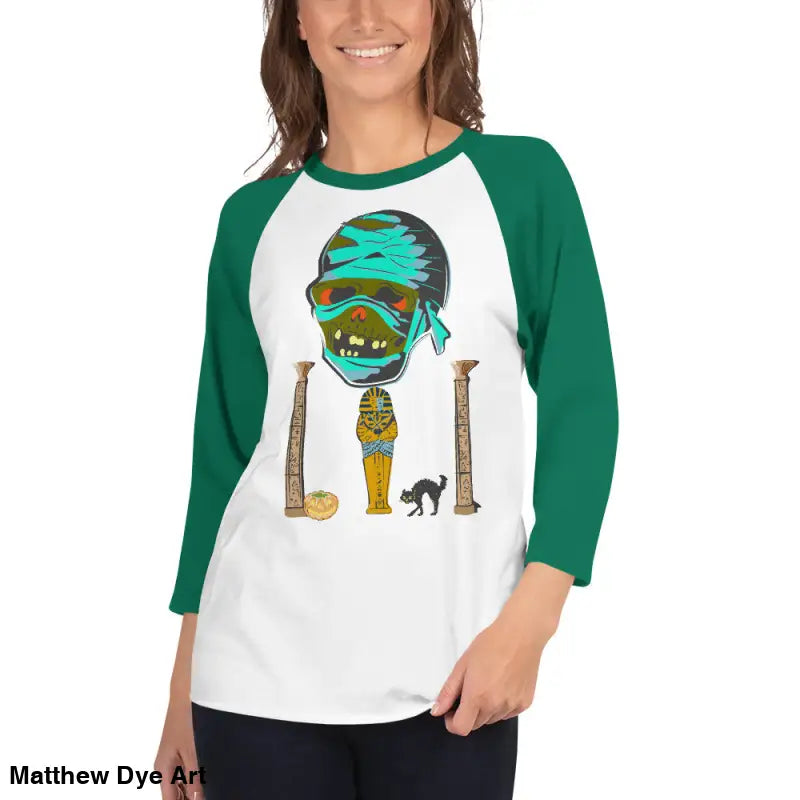 Green-sleeved mummy raglan shirt showcasing Matthew Dye art in twisted vintage Halloween style