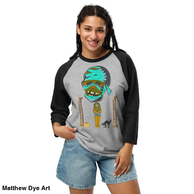 Raglan shirt featuring Matthew Dye art of a mystical mummy charm in twisted vintage Halloween style