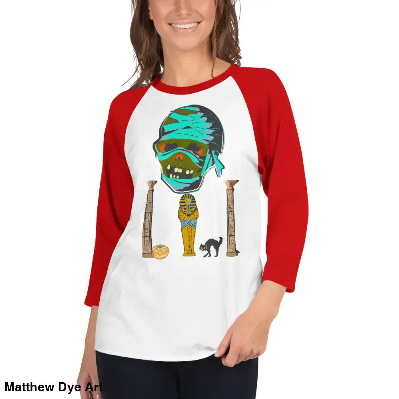 Red and white Halloween-themed raglan shirt featuring Matthew Dye art of a mystical mummy charm