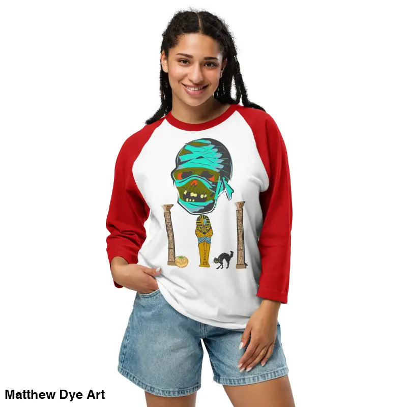 Red-sleeved raglan shirt featuring Matthew Dye art of a mystical mummy charm