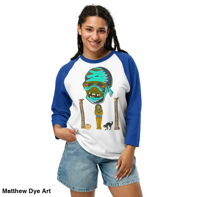 Woman’s Pharaoh’s Curse Raglan shirt featuring Matthew Dye art of a mystical mummy charm