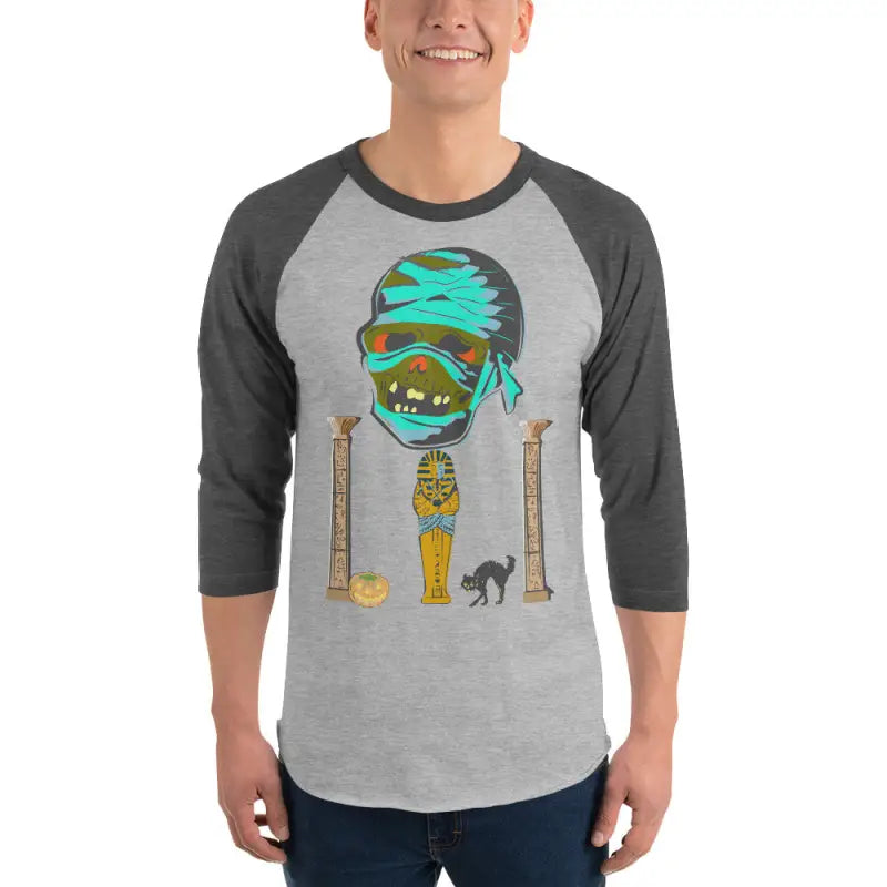 Gray raglan shirt featuring Matthew Dye art of a mystical mummy charm for Halloween