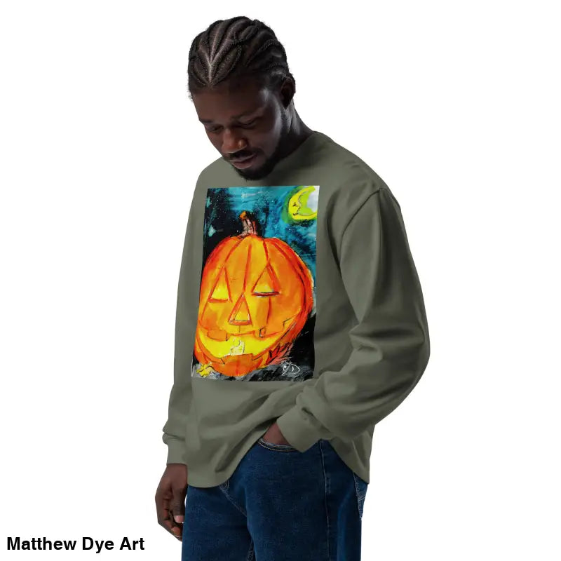 Olive green sweatshirt featuring Matthew Dye Art’s whimsical jack-o’-lantern design
