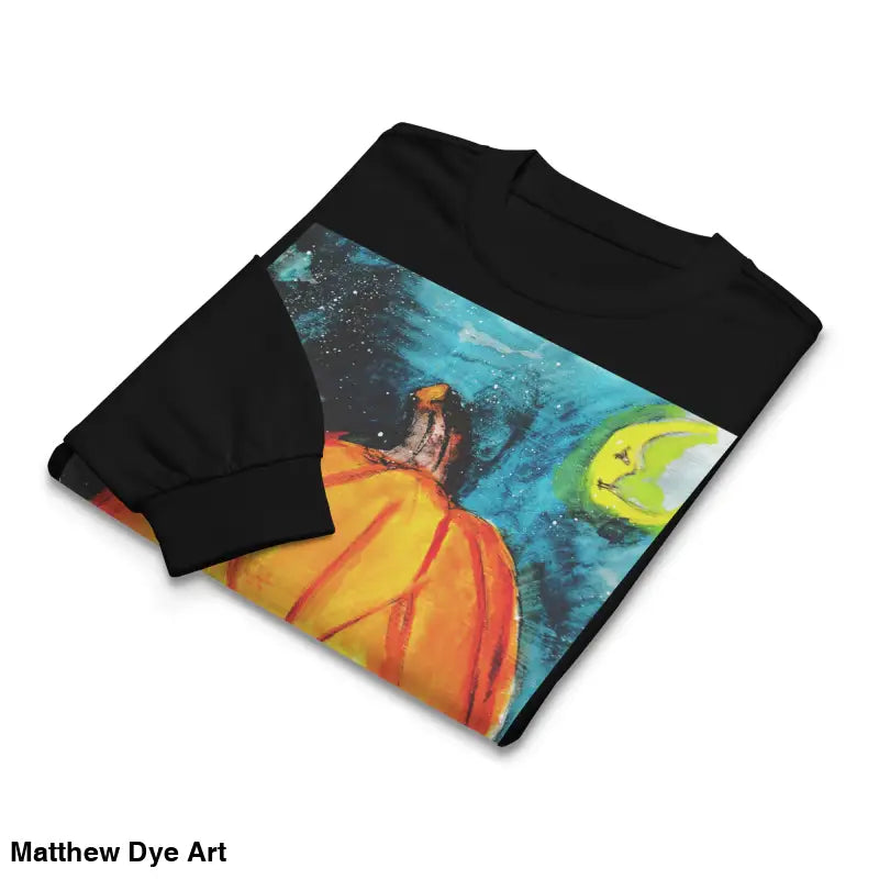 Folded black sweatshirt featuring Matthew Dye Art’s whimsical Jack-o’-Lantern design