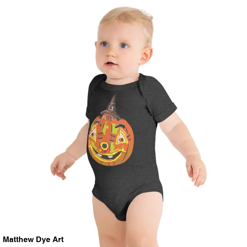 Baby in Pumpkin Witch Halloween-themed onesie featuring vintage-inspired design