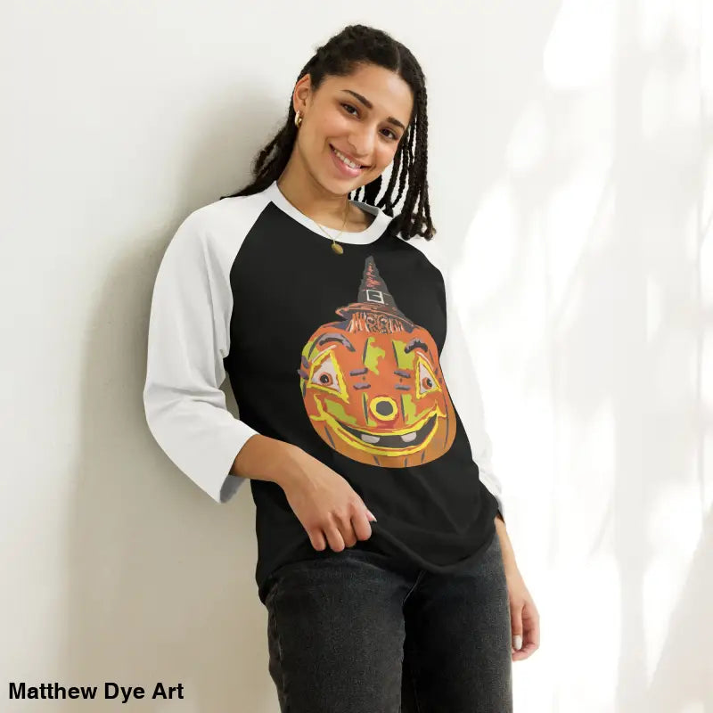Woman’s stylish raglan shirt with charming retro Halloween flair featuring a pumpkin witch design