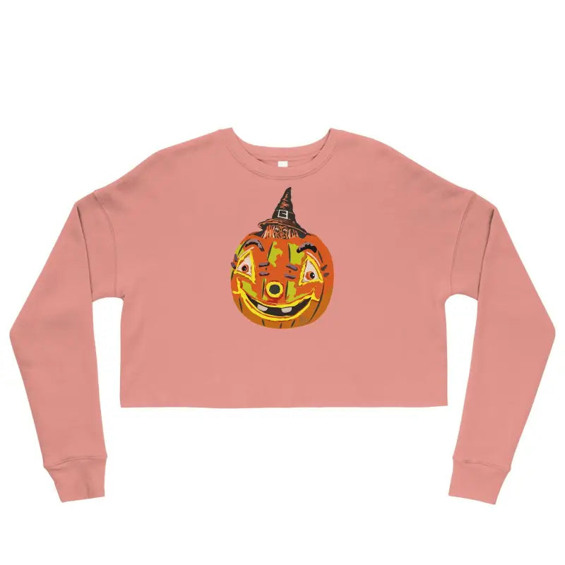 Pink crop sweatshirt featuring a smiling jack-o’-lantern in a witch hat design