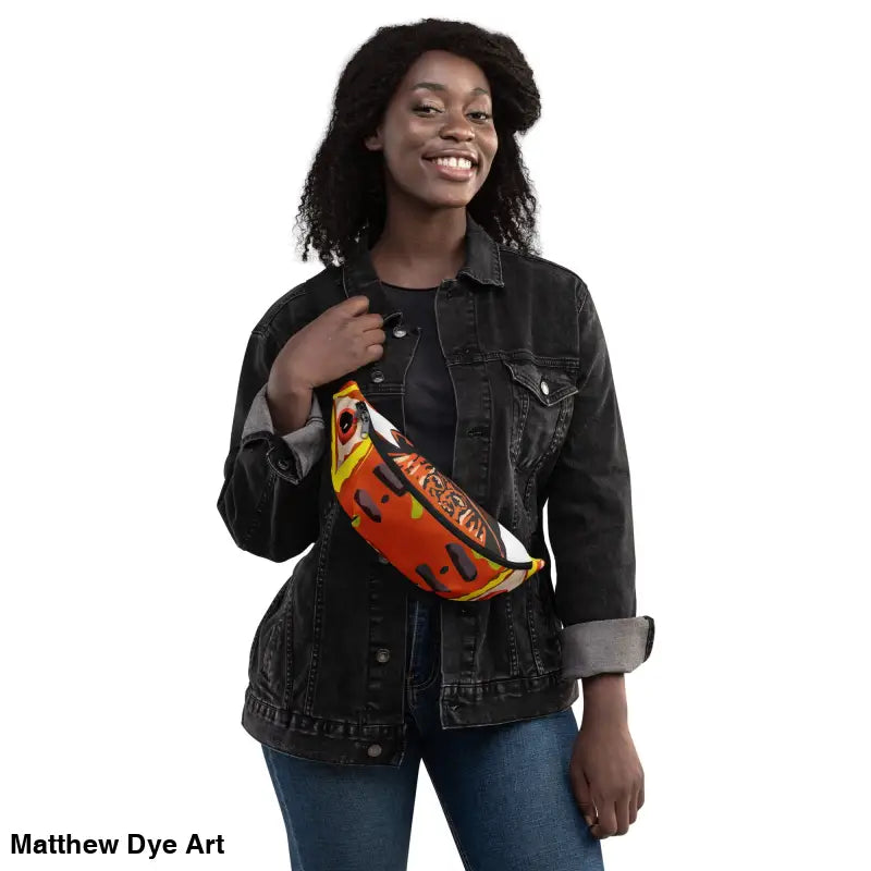 Woman showcases the Pumpkin Witch Fanny Pack, featuring Matthew Dye art with a vintage pumpkin witch design
