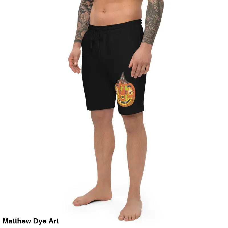 Black fleece shorts featuring pumpkin graphic by Matthew Dye Art for Pumpkin Witch men’s style