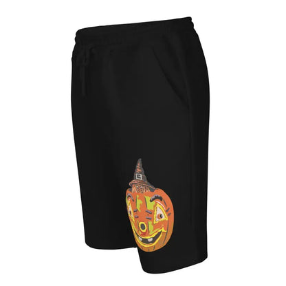 Black athletic shorts featuring a smiling jack-o’-lantern design by Matthew Dye Art