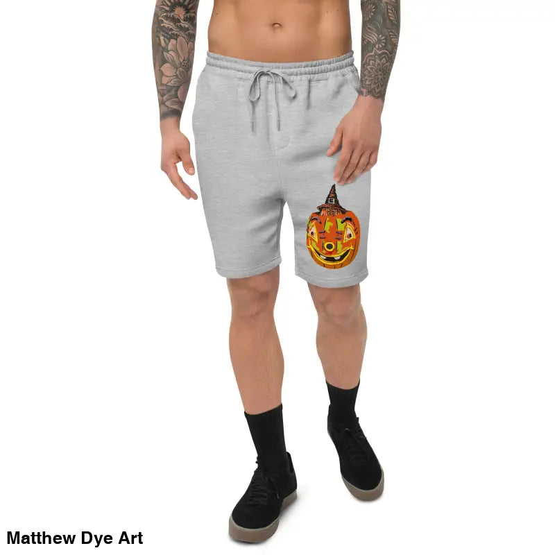 Gray shorts featuring a pumpkin design from Matthew Dye Art for the Pumpkin Witch men’s fleece