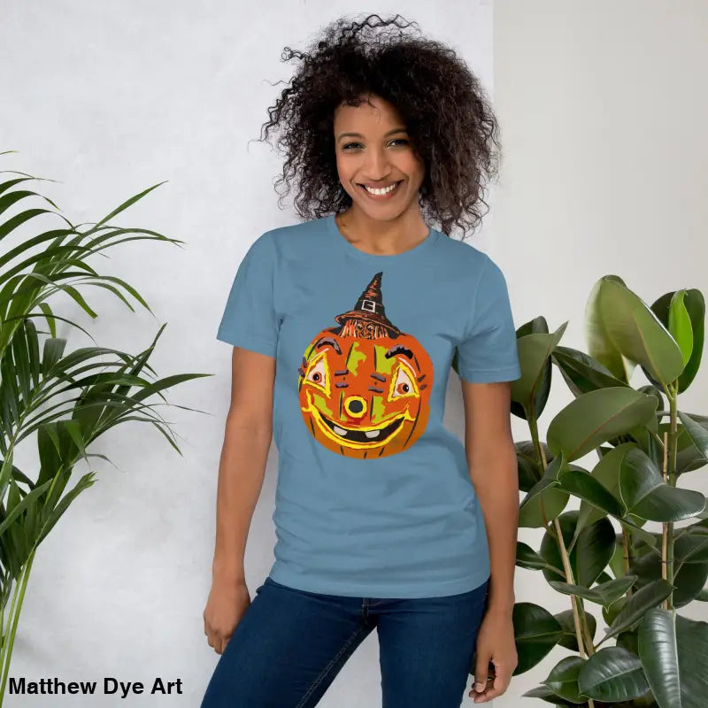 Blue t-shirt featuring pumpkin witch graphic, ideal comfortable cotton Halloween tee