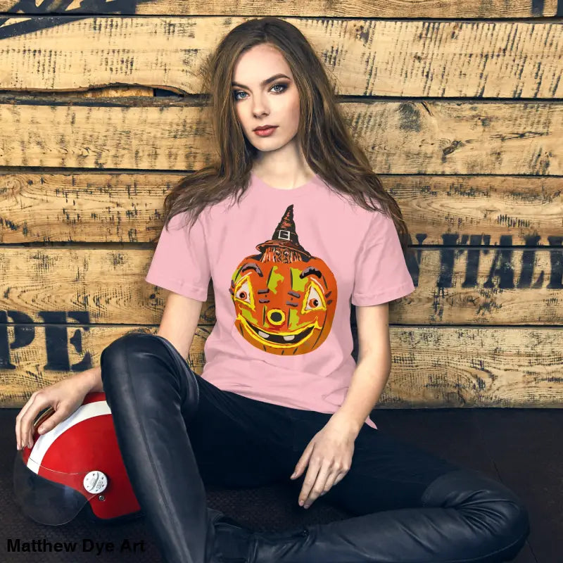 Pink Halloween pumpkin t-shirt featuring the Pumpkin Witch design on a comfortable cotton tee