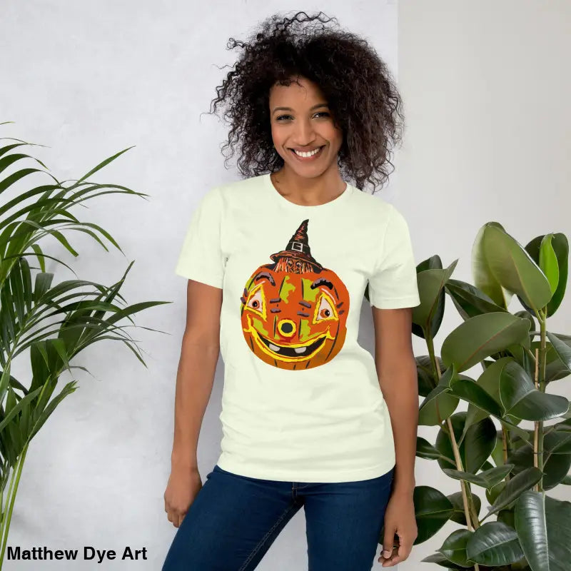 Woman modeling a comfortable cotton pumpkin witch unisex tee for Halloween