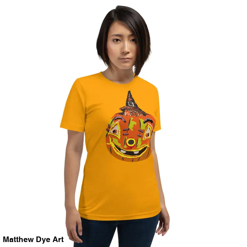 Woman wearing a comfortable cotton pumpkin witch unisex tee for Halloween festivities