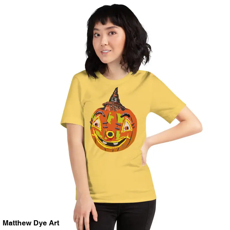 Yellow Halloween t-shirt featuring pumpkin witch graphic on comfortable cotton unisex tee