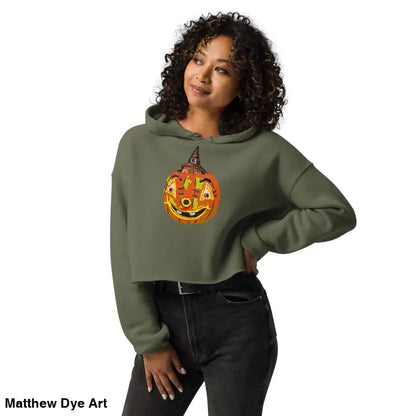 Woman in a cropped hoodie featuring a vintage Halloween pumpkin design
