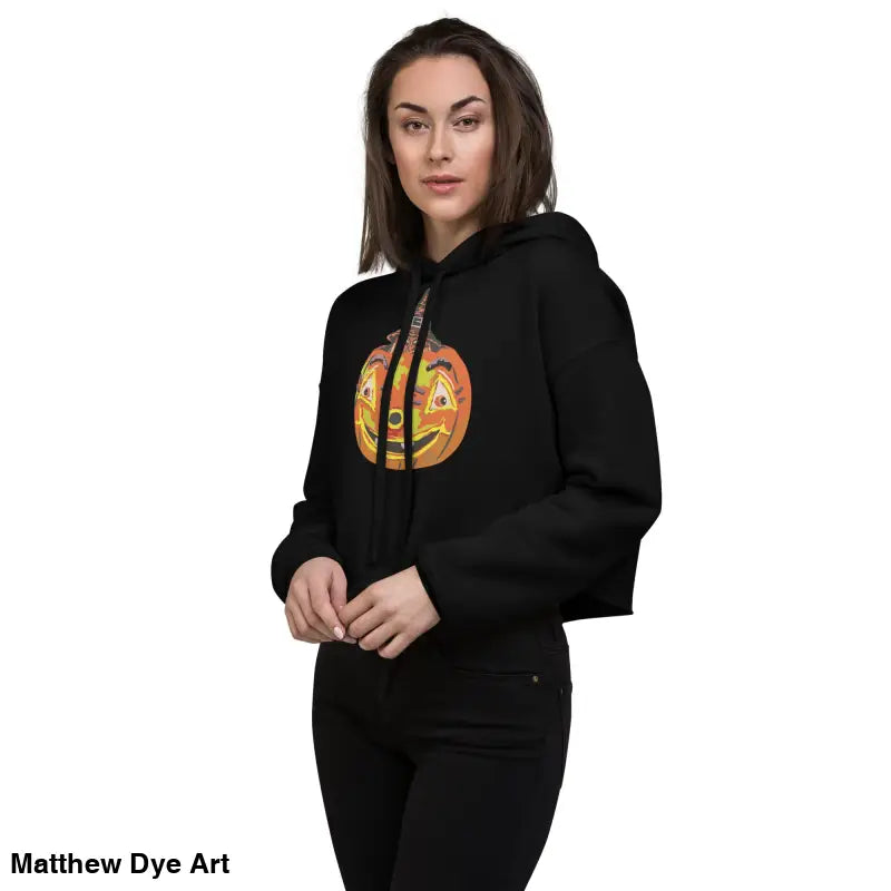 Black cropped hoodie featuring a vintage Halloween pumpkin graphic for the enchanted pumpkin witch