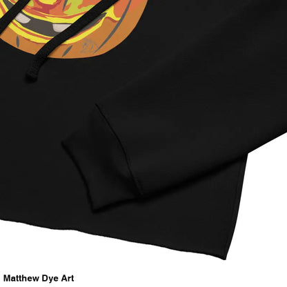 Black cropped hoodie featuring an enchanted pumpkin witch design for Halloween