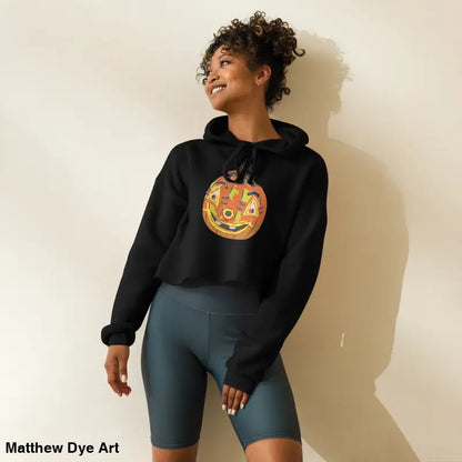 Woman in a Pumpkin Witch Spellbound hoodie featuring an enchanted pumpkin design